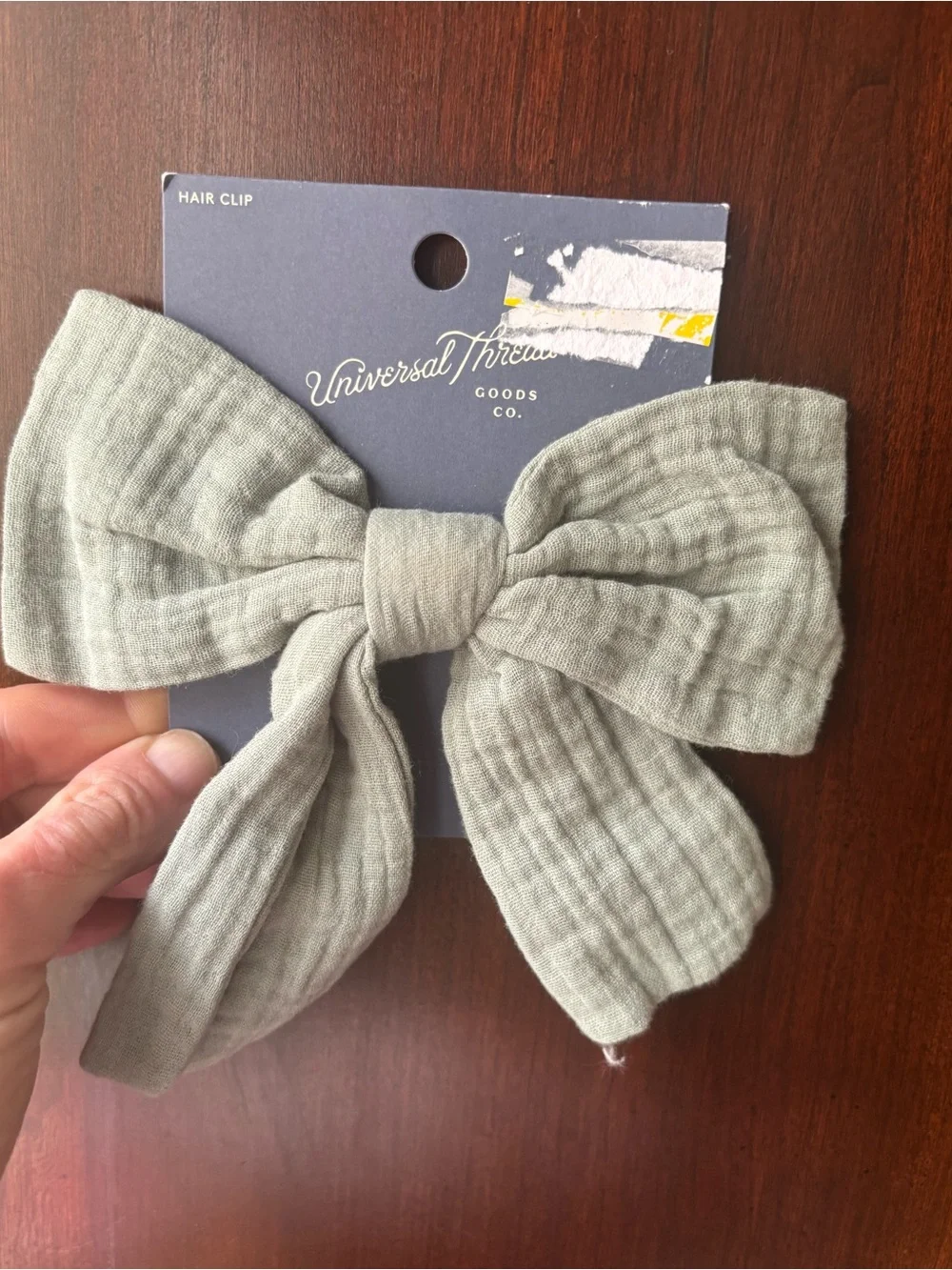 NWT large sage green hair bow of muslin fabric on silver clip, one size